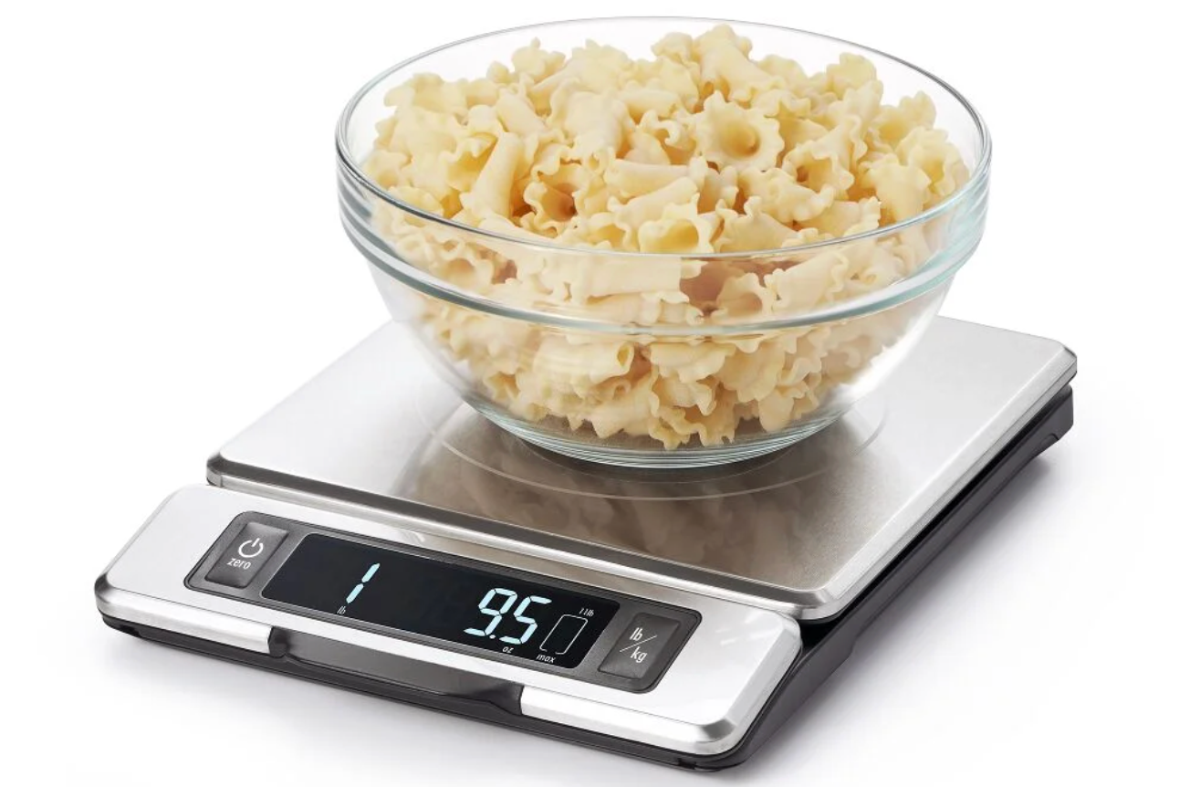 Digital food scale with bowl of popcorn on top